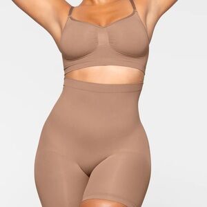 SKIMS Sculpting Mid Thigh Shorts in Sienna